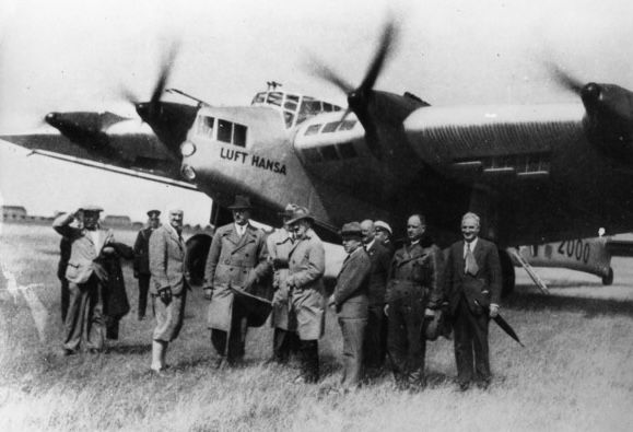 Members of the National Socialist party in front of a Lufthansa plane.