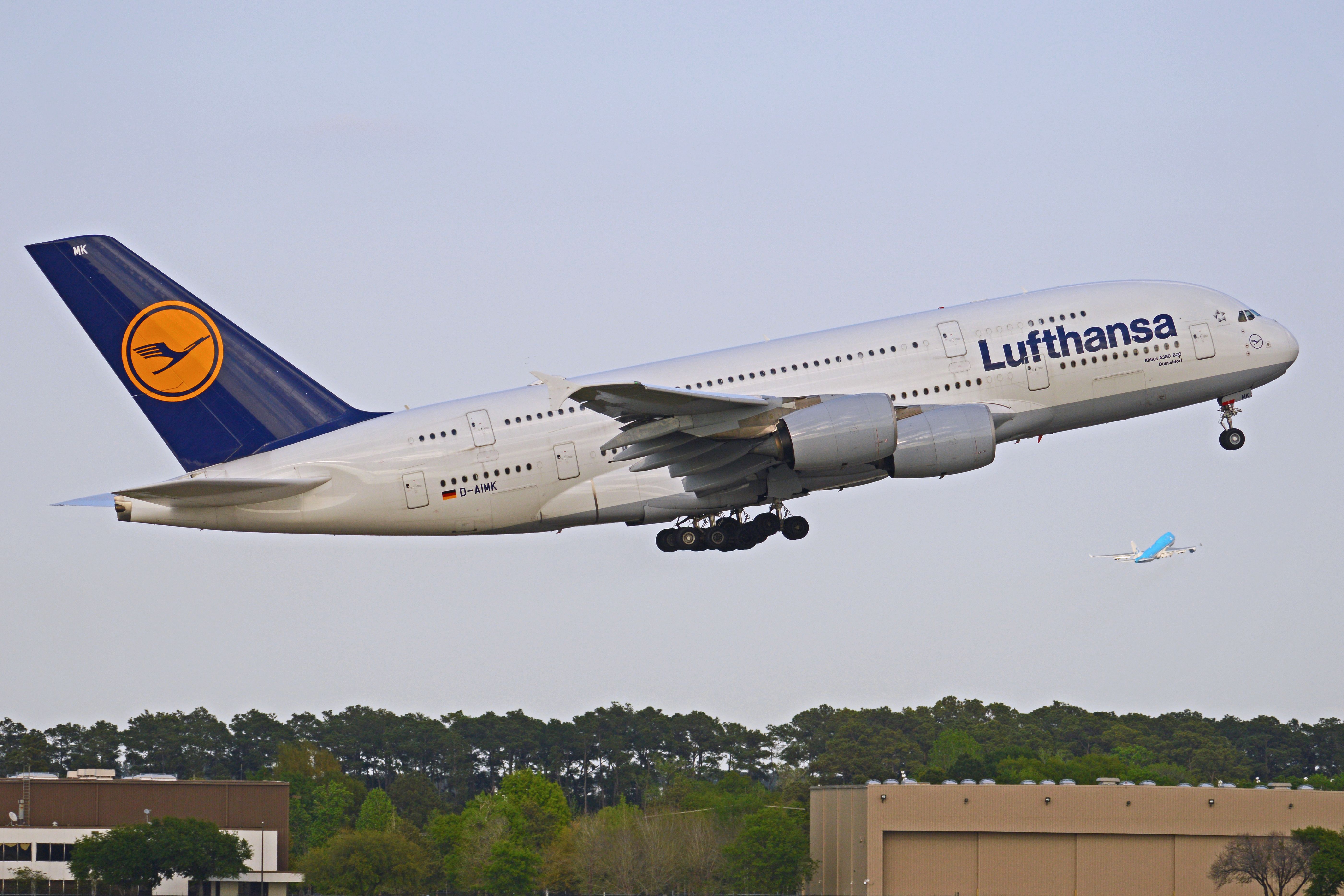 Lufthansa A380 taking off, another plane visible in the background.