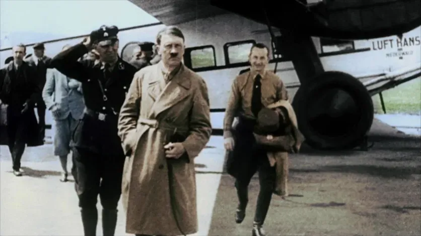 Adolf Hitler and other members of the National Socialist part in front of Hitler's Lufthansa plane, D-1720.