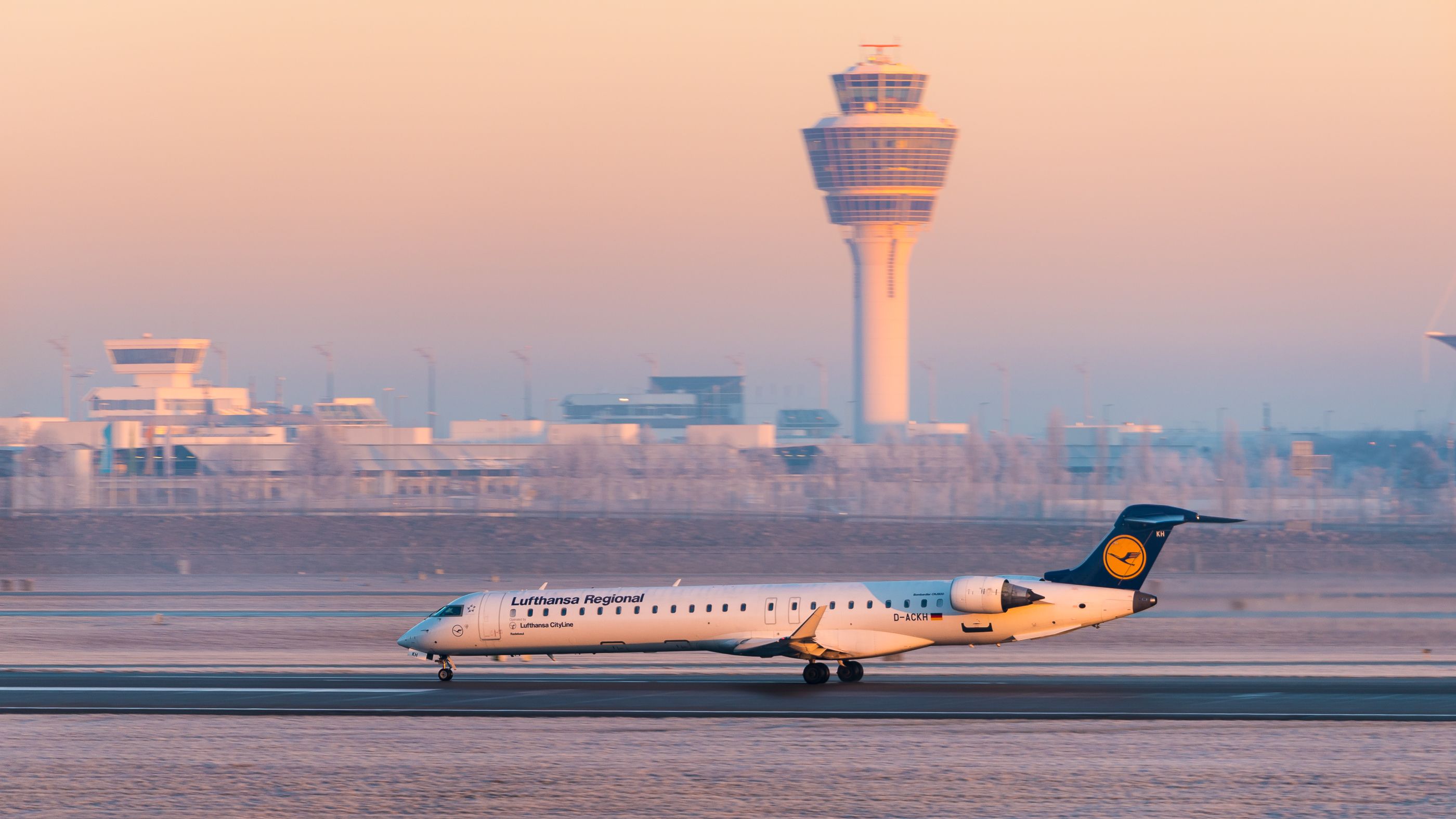 Lufthansa CityLine CRJ-900LR D-ACKH plane taking off at dawn at Munich Airport